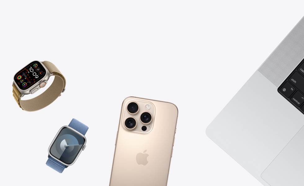 Vários produtos dispersos, incluindo o Apple Watch em Natural e pulseira loop Alpina canela, Apple Watch prateado com pulseira loop esportiva azul-violeta, iPhone titânio-deserto e MacBook prateado
