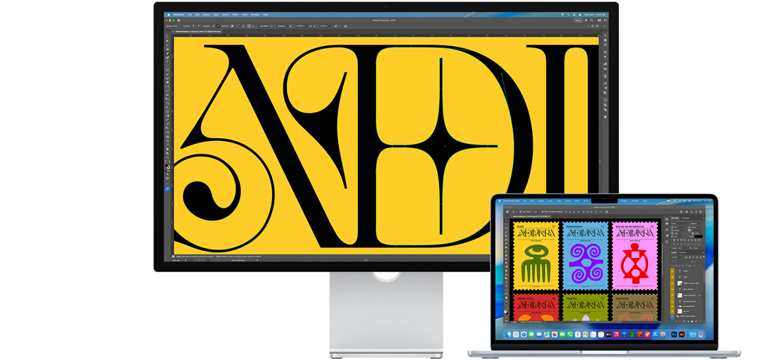 Studio Display and a Mac laptop showing a project being worked on in multiple Adobe programs, Studio Display shows a close-up on black text against a rich yellow background, the anti-reflective coating helps reduce glare