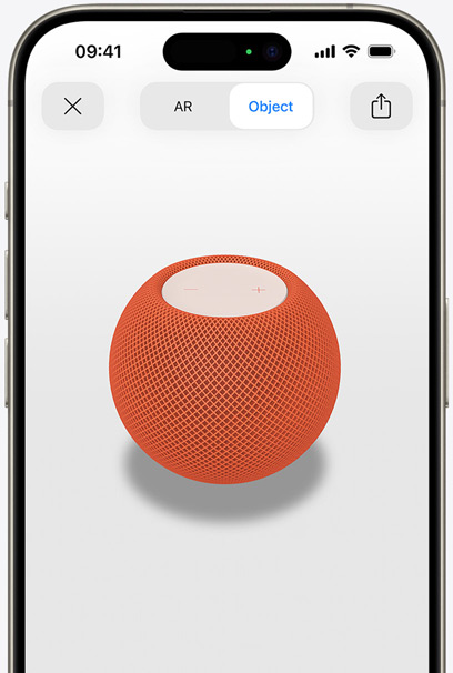 Orange HomePod on the screen of an iPhone in AR view.