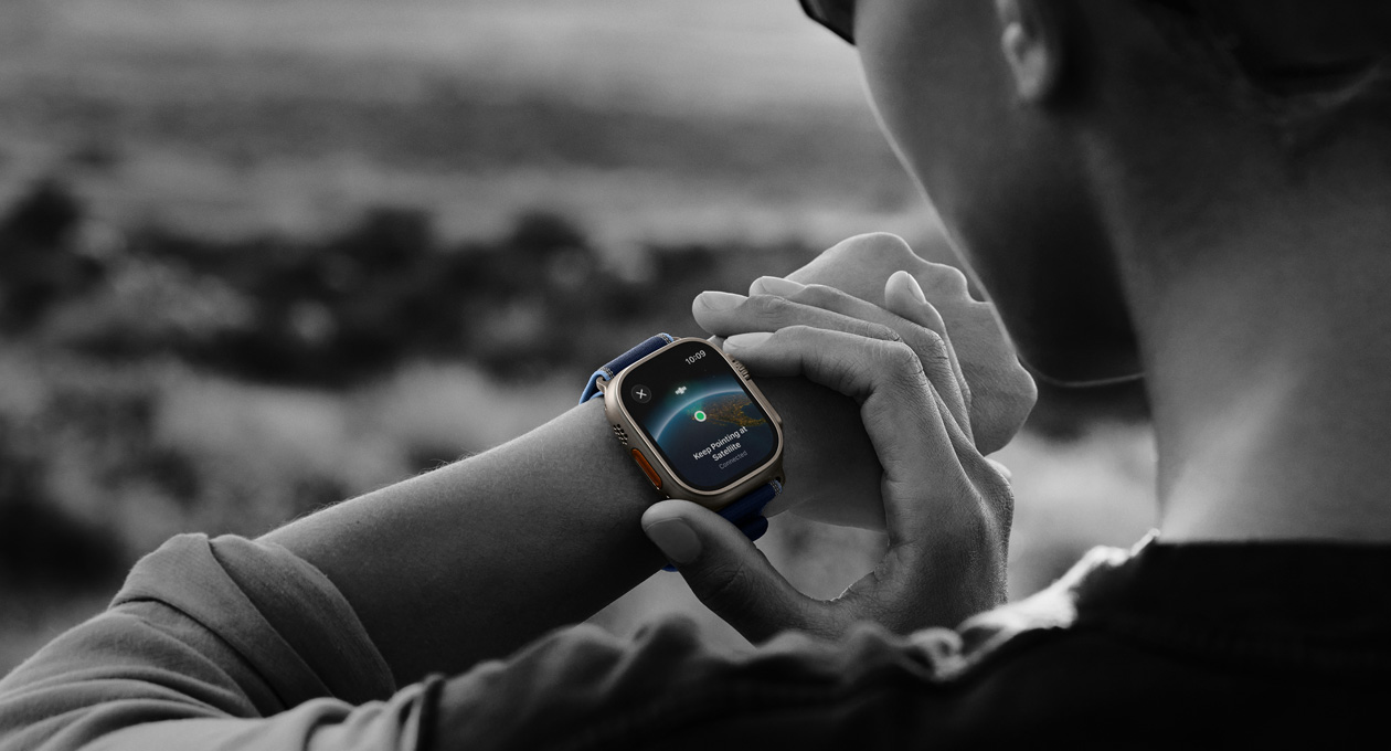 A person uses two-way satellite communication on Apple Watch Ultra 3 while hiking